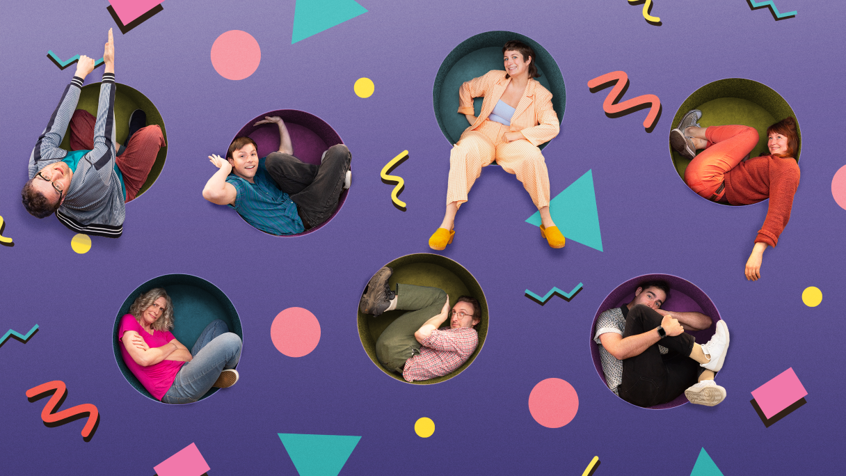 people sitting in circular shaped holes in a wall